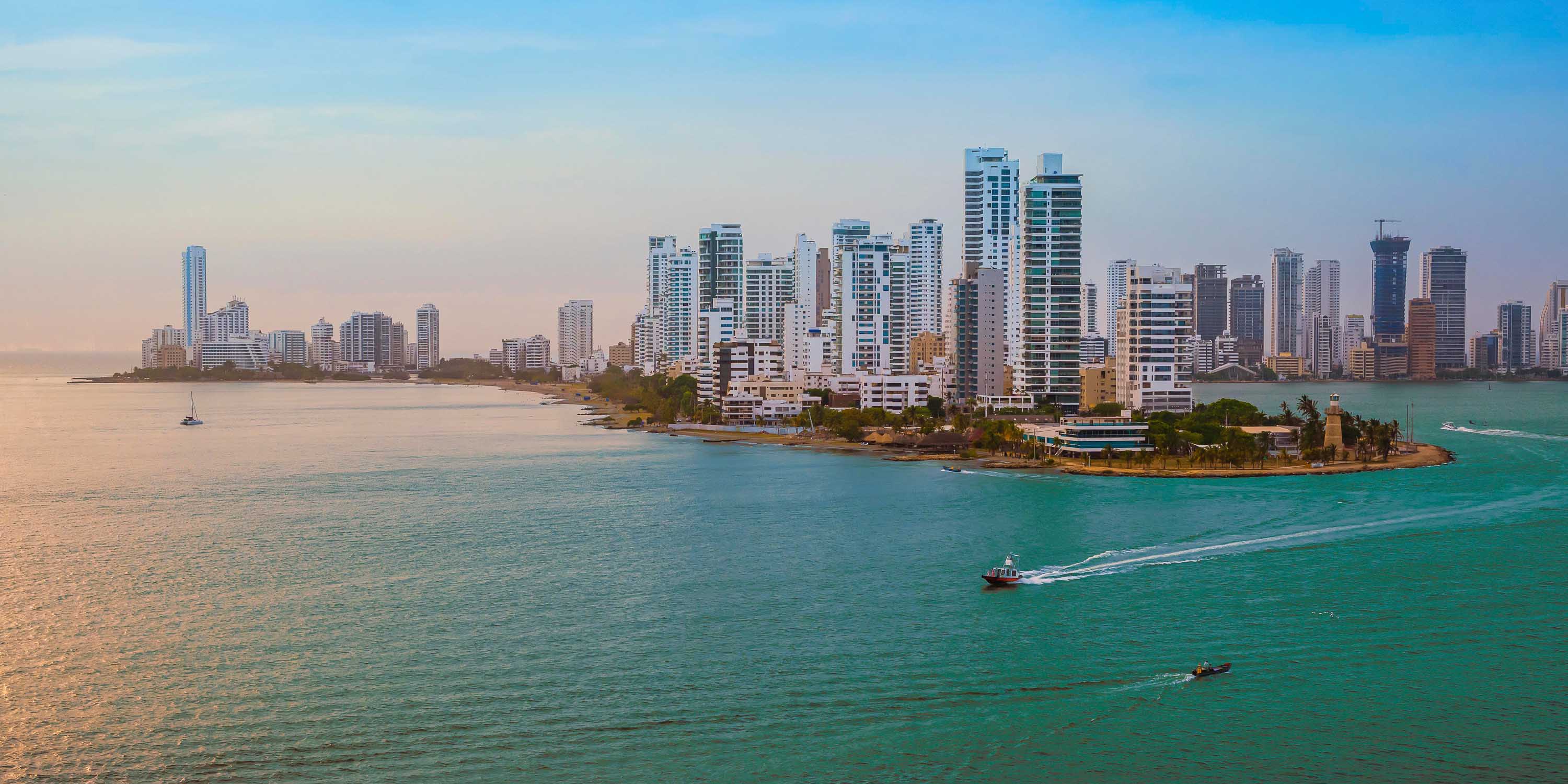 aerial view of a skyline of the city of Cartagena, in Colombia with turquoise blue water, and boats sailing