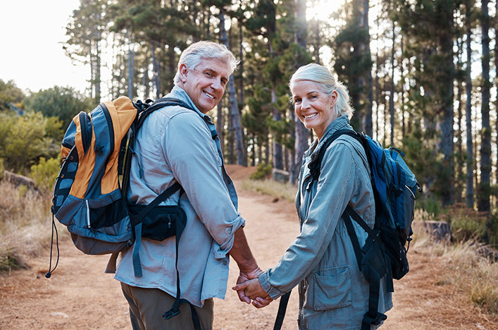 Couple holding hands while bush walking