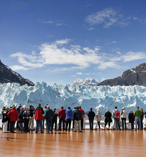Group tour looking up at glacier