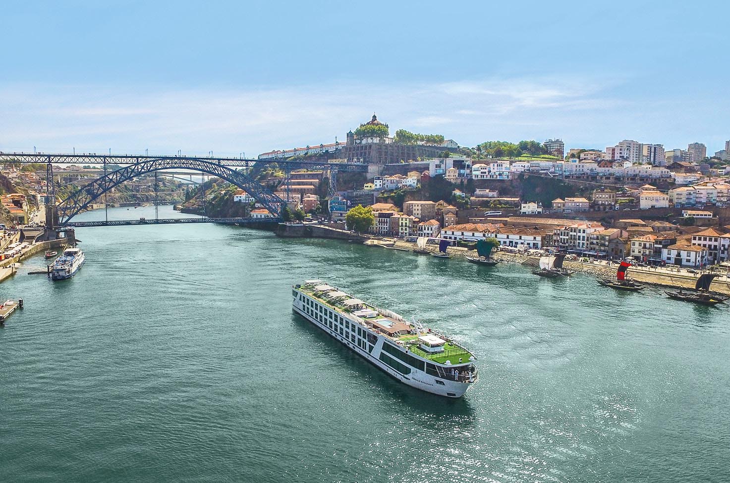 Luxury river ship sailing the Douro river through Porto, Portugal