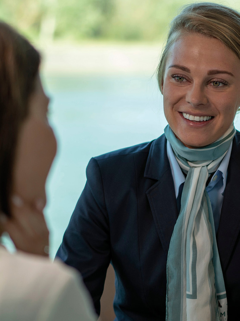 Emerald cruise director with two guests