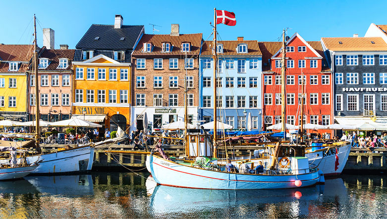Aerial view of Copenhagen, Denmark with colourful buildings, canals, and boats