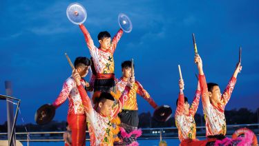 A Lion Dance performance for guests on the Sun Deck of an Emerald Cruises river cruise along the Mekong River
