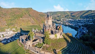Castle in Cochem prominently set on a hill above the Moselle River