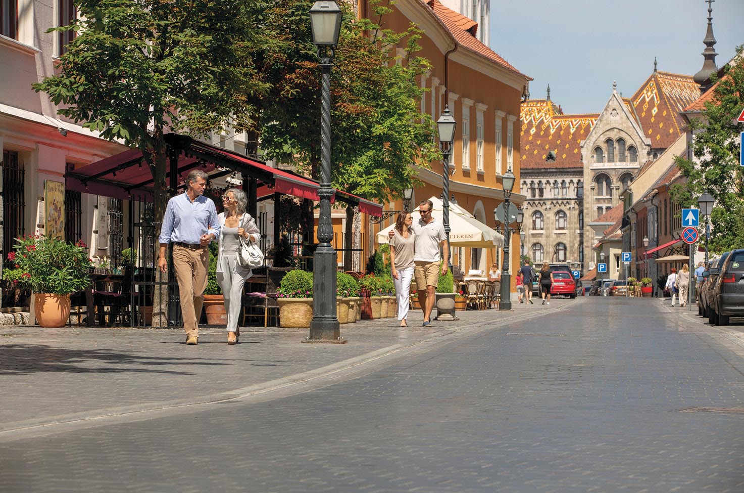 Friends exploring a quaint street with beautiful buildings in the heart of Budapest