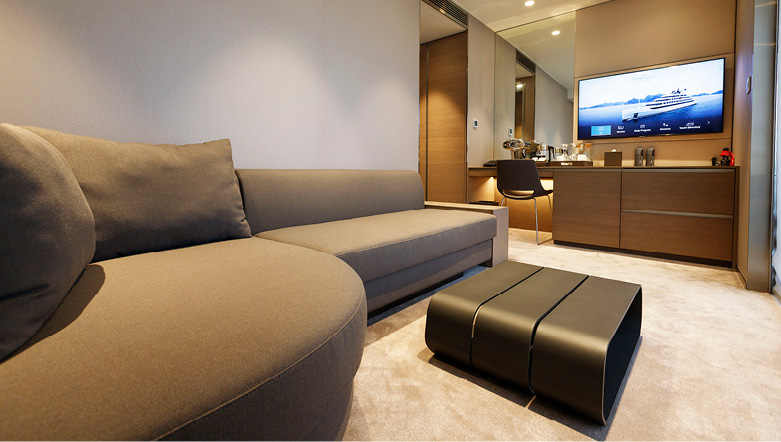 A large cabin on board an Emerald Cruises yacht with a separate lounge area for relaxing and watching TV